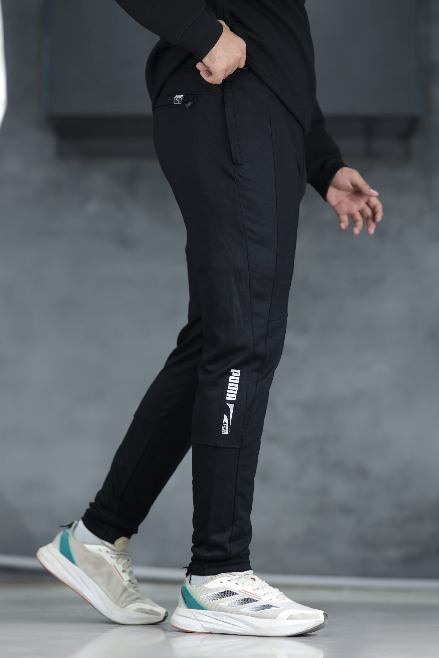 BLK-1_934f5e50-c408-4360-96d9-a274144eb1ba PUMA Evostripe Grip Style Slim-Fit Trouser-325 - Image 1
